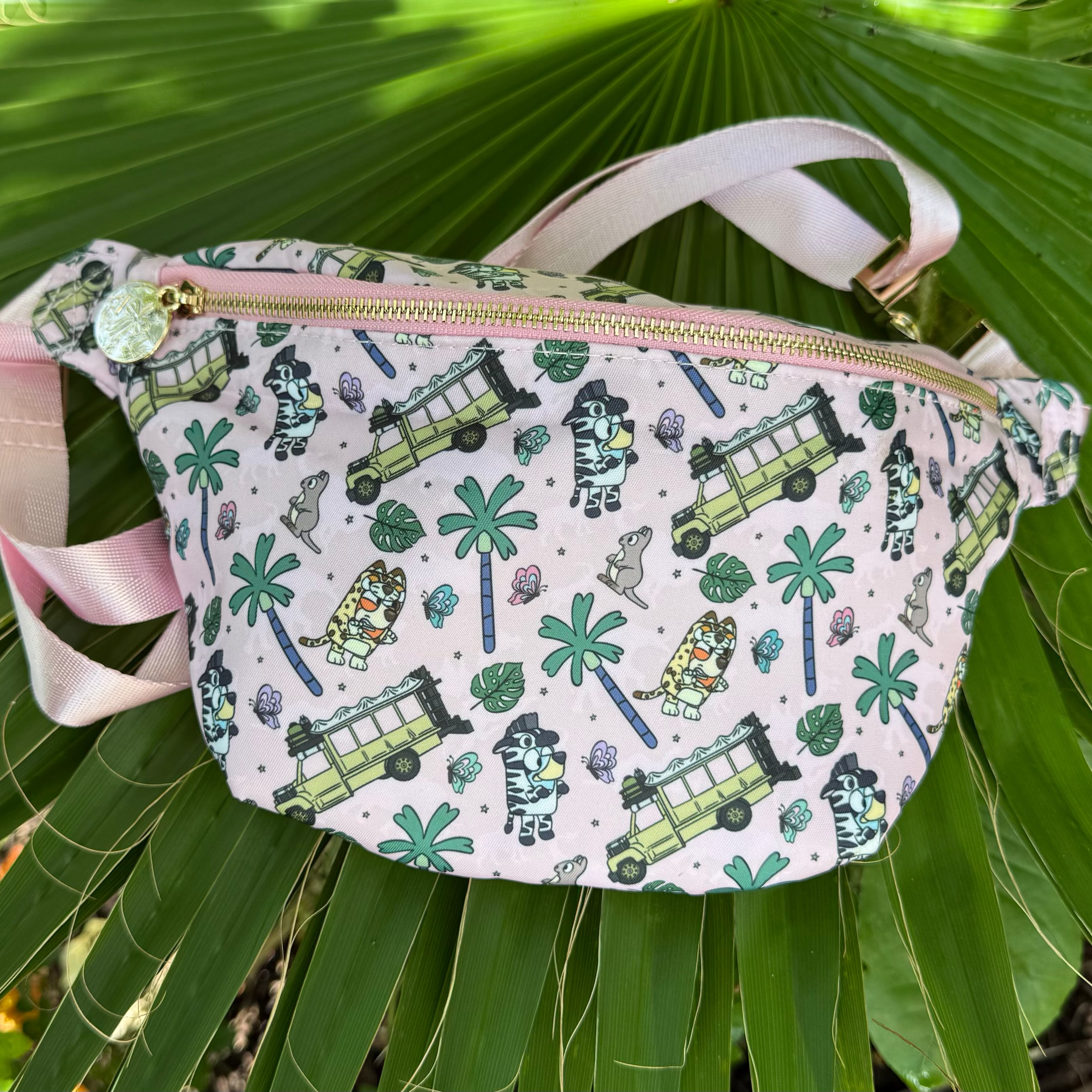 Fanny pack with nature-themed design on green leaves