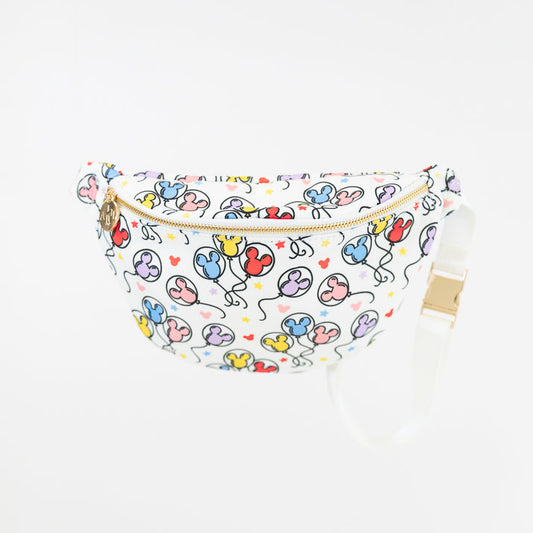 A white fanny pack with a colorful balloon print and a white adjustable strap, shown against a plain white background.