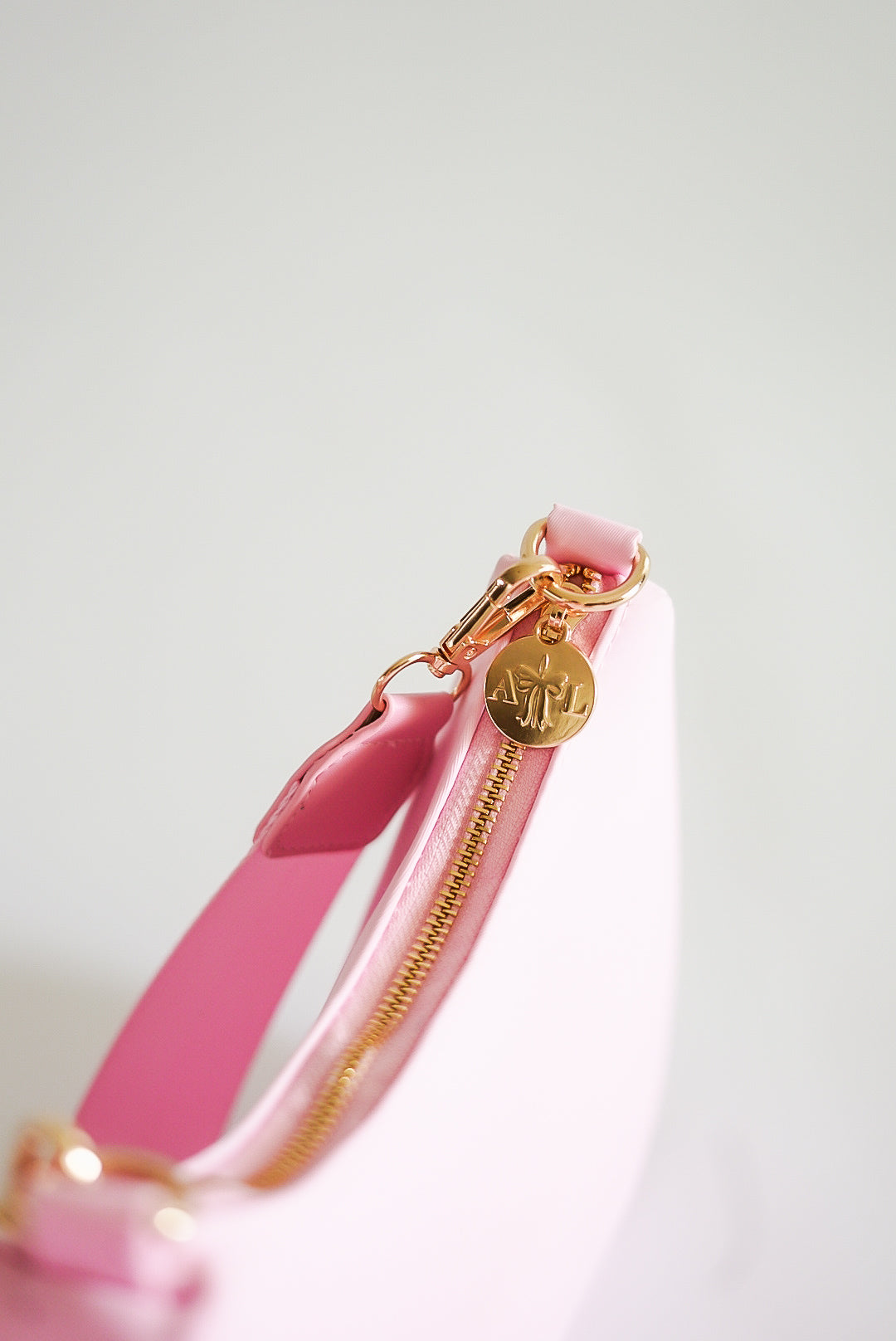 Pink Curved Crossbody Bag