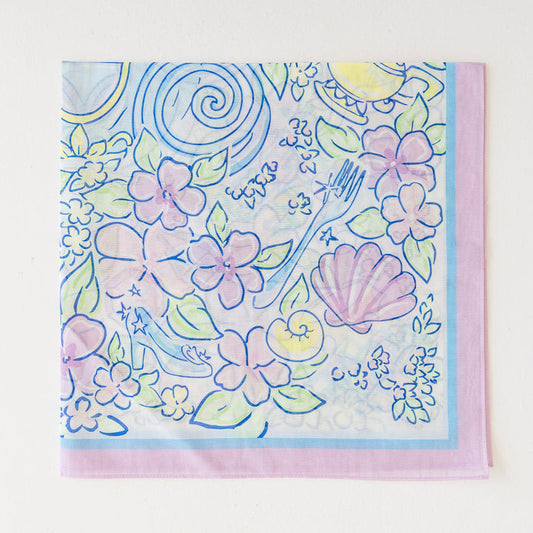 A floral scarf folded into fourths.