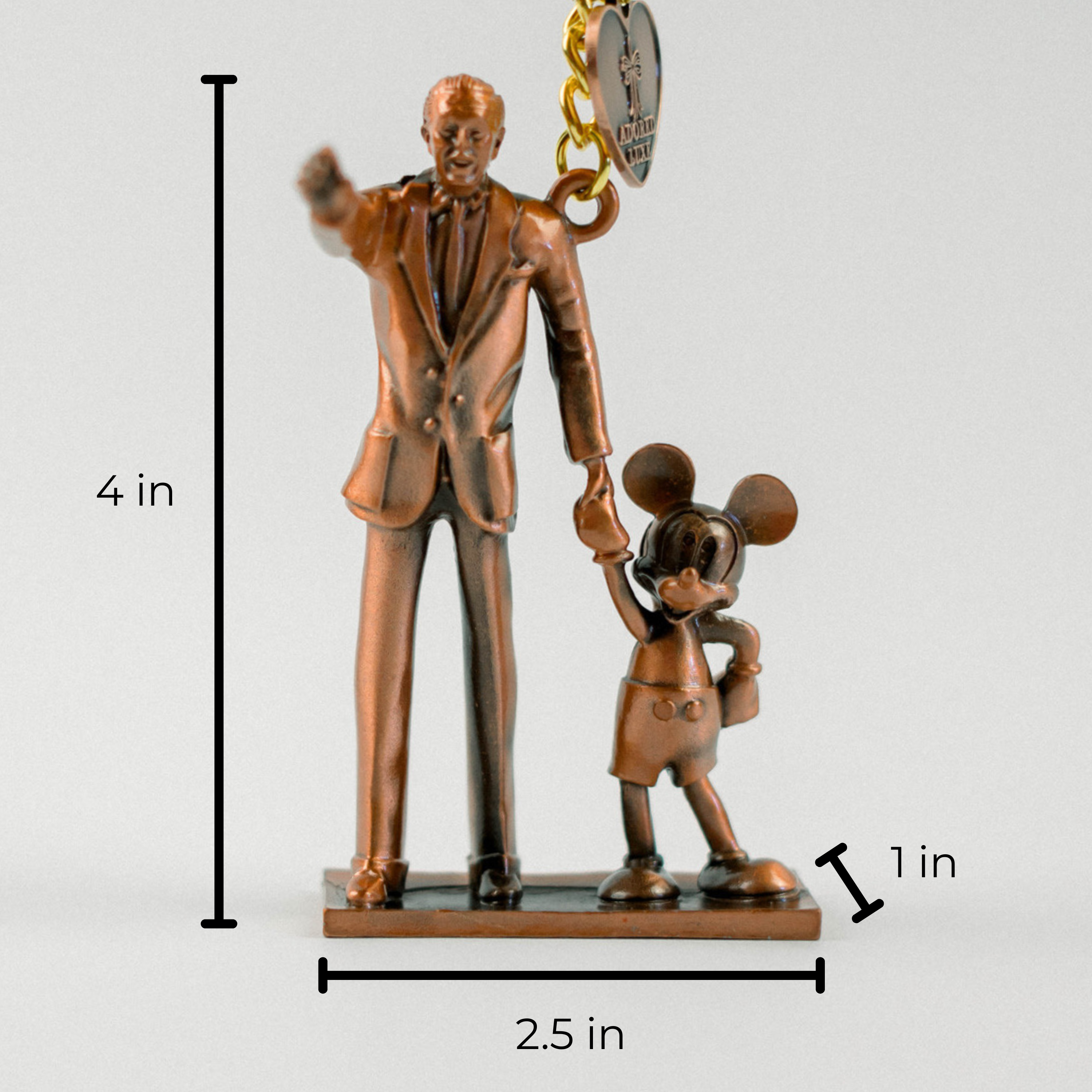 Bronze statue of a man and a mouse with measurements on a white background