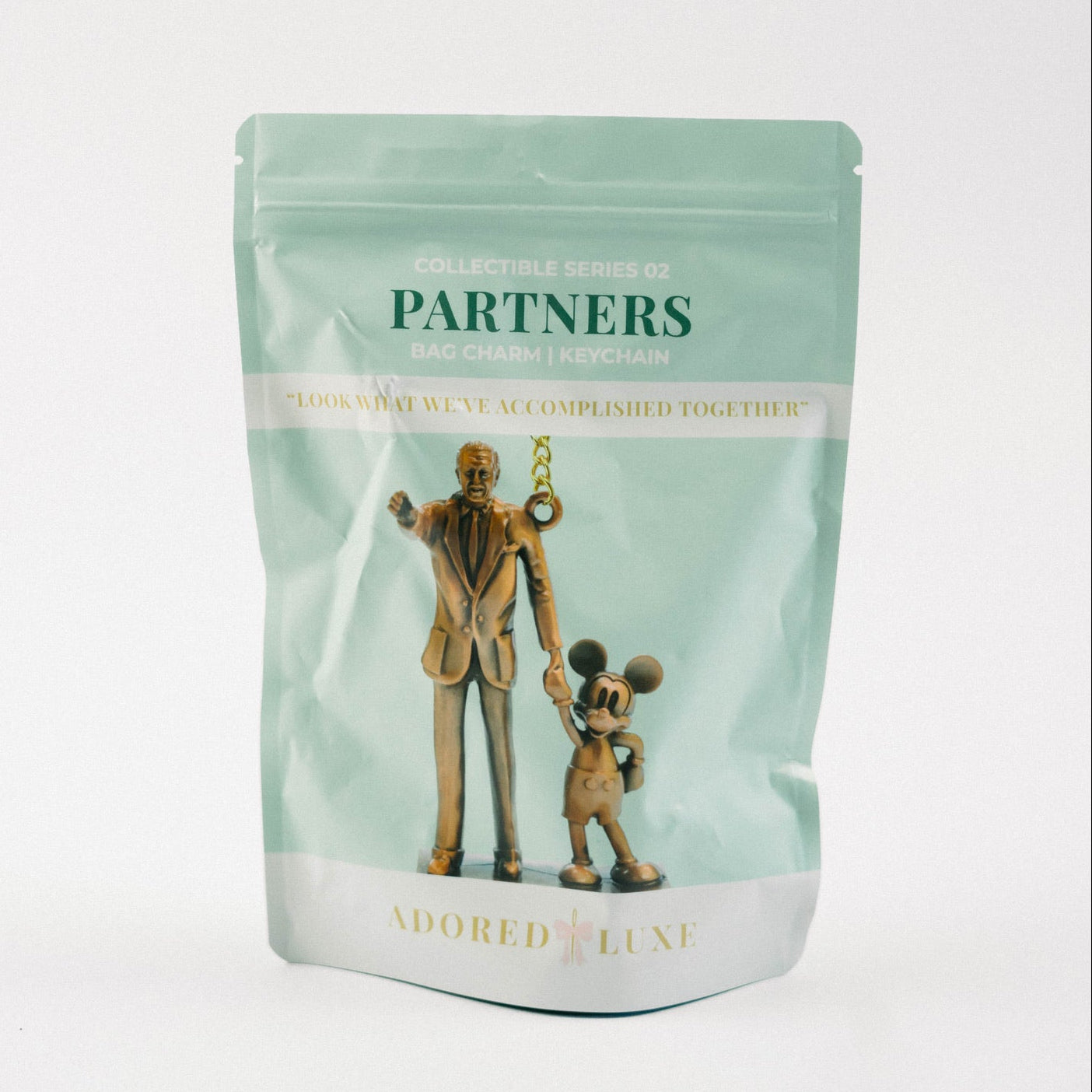 Green packaging with illustrations of a man and mouse on a white background