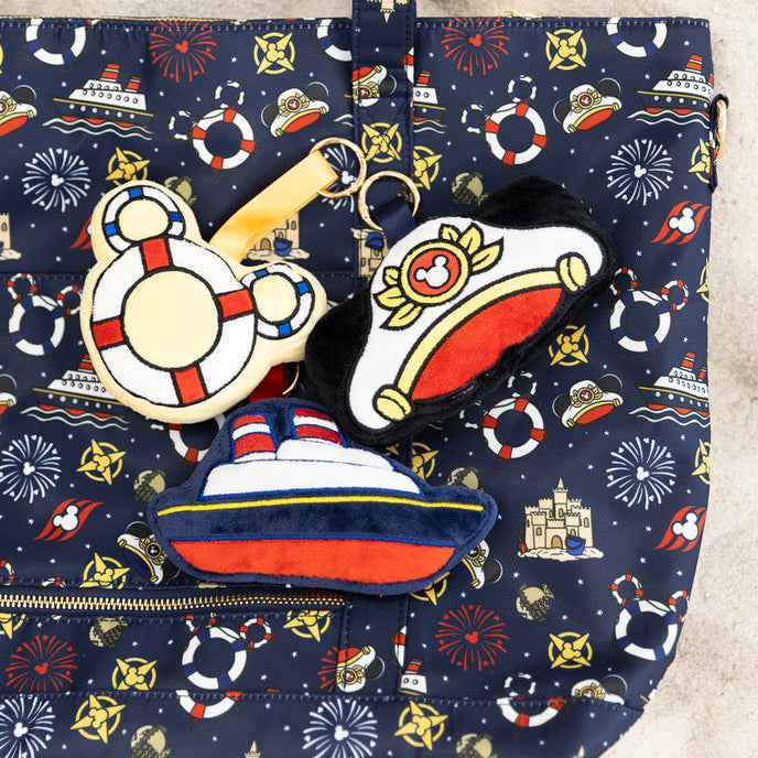 Nautical-themed tote bag with colorful designs on a beige background